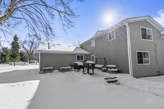 view of snow covered house