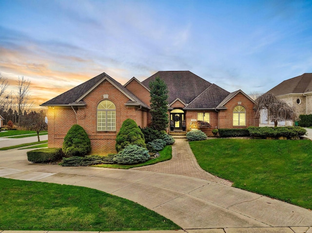 ranch-style house with a yard