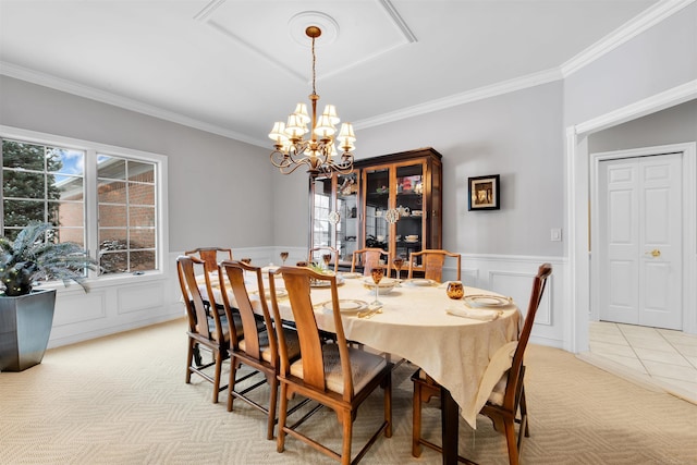 carpeted dining room with a notable chandelier and ornamental molding