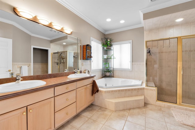 bathroom with tile patterned floors, vanity, crown molding, and independent shower and bath