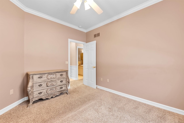 unfurnished bedroom featuring ornamental molding, light carpet, and ceiling fan