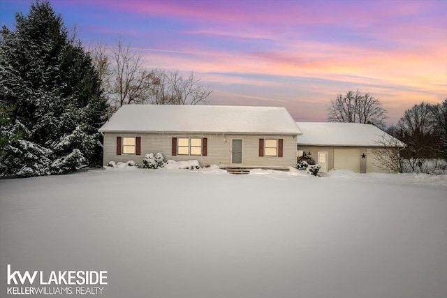 ranch-style house with a detached garage