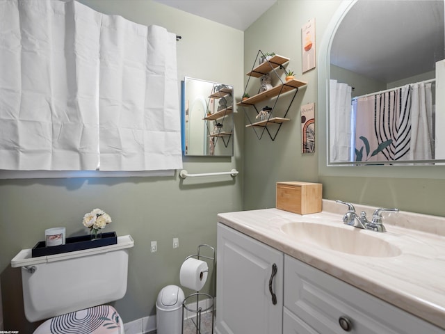 full bathroom featuring vanity and toilet