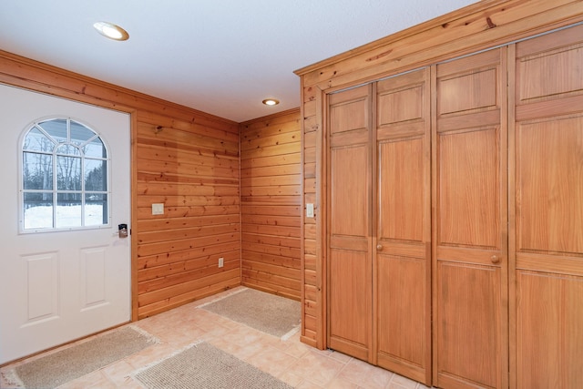 interior space with recessed lighting and wood walls