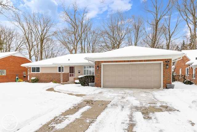 single story home featuring brick siding and an attached garage