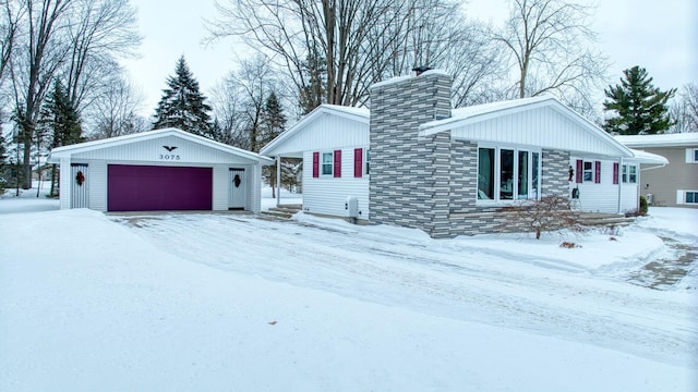 view of front of home featuring a chimney