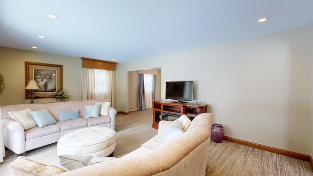 living area with baseboards and recessed lighting