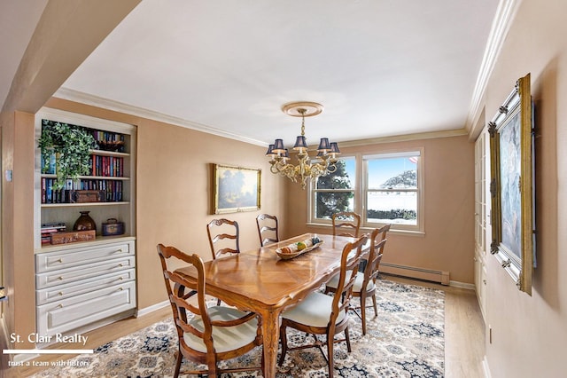 dining room featuring light wood finished floors, a baseboard heating unit, and ornamental molding