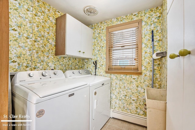 clothes washing area featuring a baseboard heating unit, visible vents, independent washer and dryer, cabinet space, and wallpapered walls