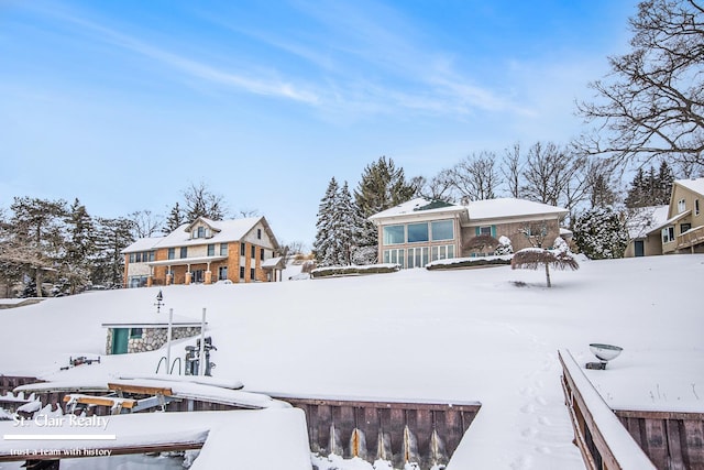 view of snow covered house