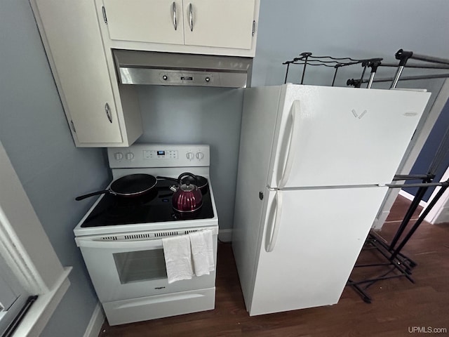 233 W Pewabic St, Ironwood, MI 49938 - kitchen featuring white appliances, range hood, dark wood finished floors, and white cabinetry