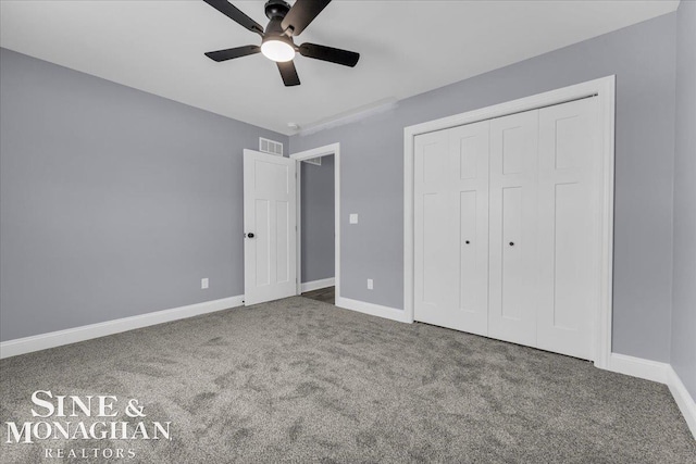 unfurnished bedroom featuring carpet floors, a closet, visible vents, and baseboards