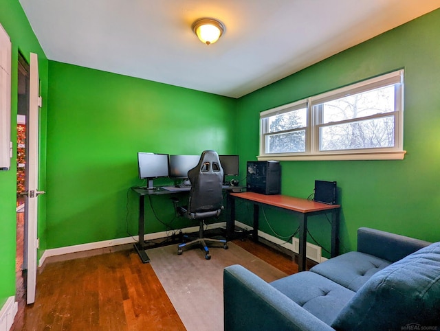 office featuring baseboards and dark wood-style flooring