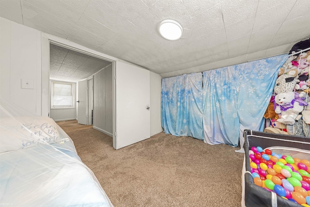 bedroom featuring light colored carpet