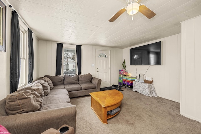 living room featuring ceiling fan and light colored carpet