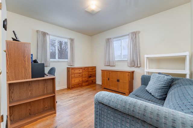 sitting room with light wood-style flooring and baseboards