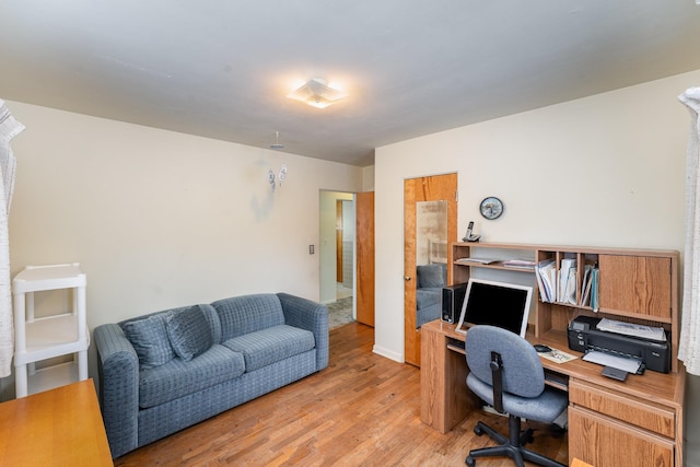 home office with light wood-type flooring