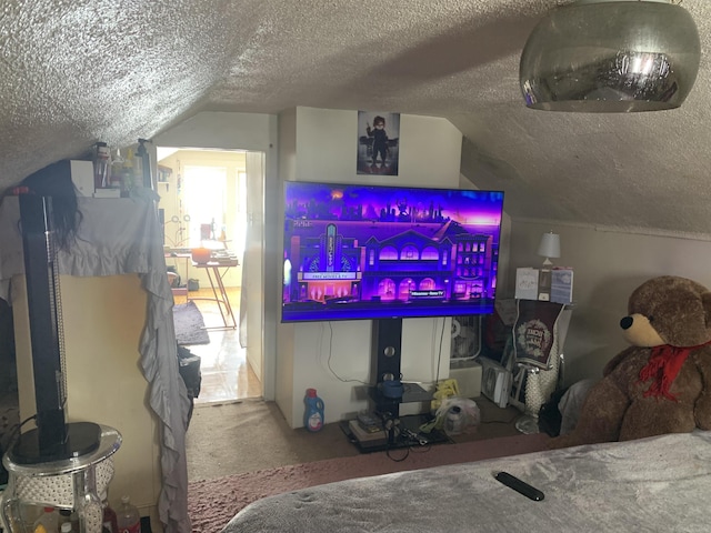 bar with lofted ceiling, carpet, and a textured ceiling