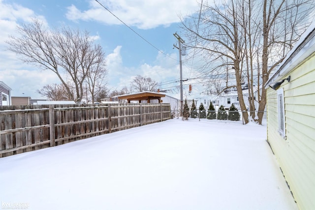 yard covered in snow featuring fence private yard