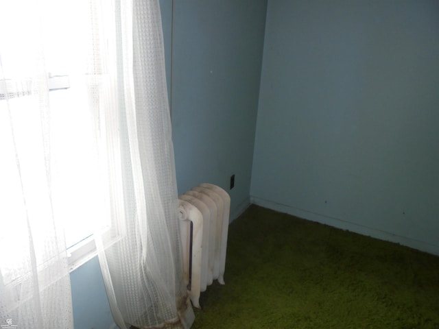3606 Cadieux Rd, Detroit, MI 48224 - carpeted empty room featuring radiator