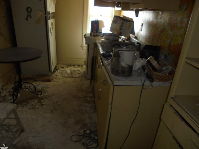 3606 Cadieux Rd, Detroit, MI 48224 - kitchen with freestanding refrigerator and white cabinets