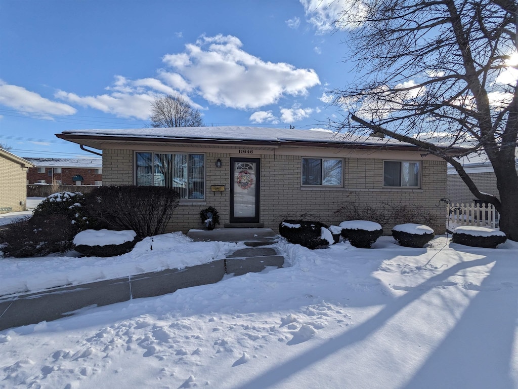 view of front of home featuring brick siding