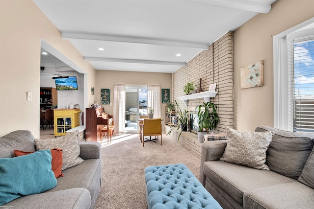 carpeted living area featuring a brick fireplace, beam ceiling, and recessed lighting