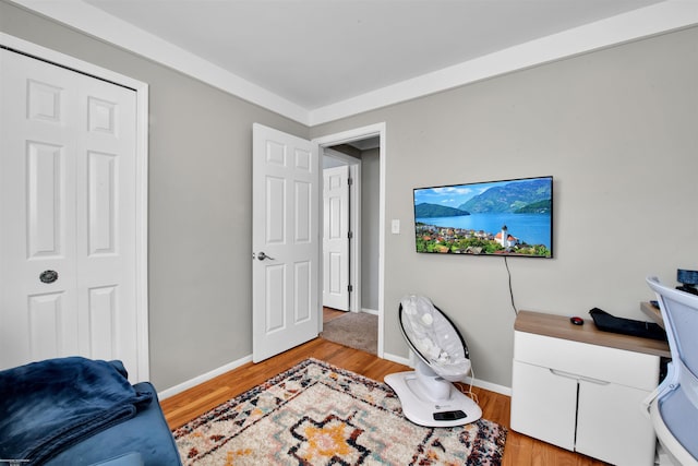 home office featuring light wood finished floors and baseboards