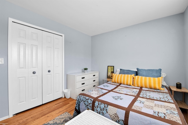 bedroom featuring a closet and wood finished floors