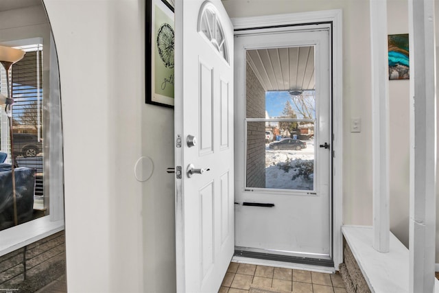 entryway with light tile patterned floors