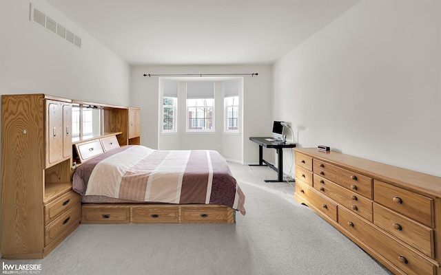 bedroom with light colored carpet and visible vents