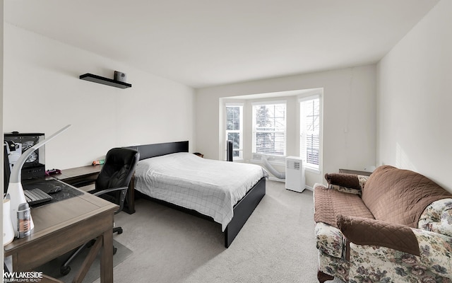 bedroom featuring light colored carpet