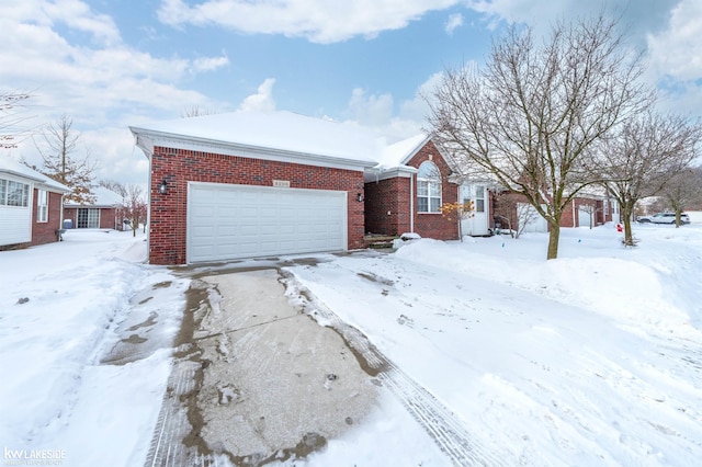 view of front facade with brick siding and an attached garage