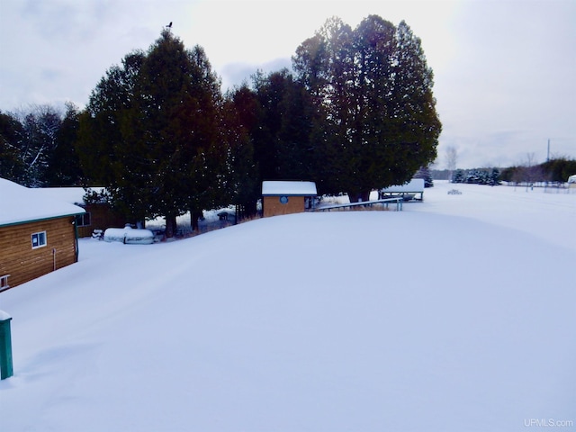 view of yard layered in snow