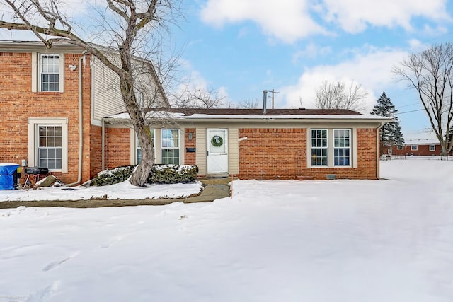 view of front of home featuring brick siding