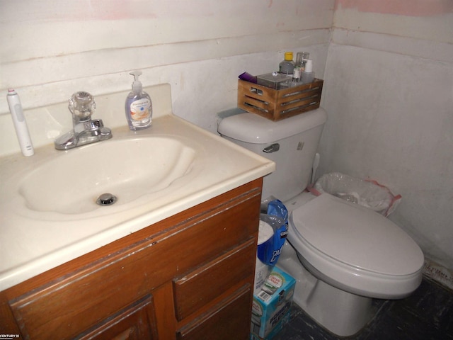 bathroom with toilet and vanity