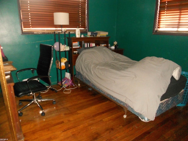 bedroom with wood finished floors