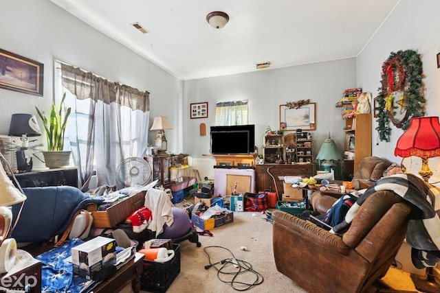 living room featuring visible vents and carpet flooring