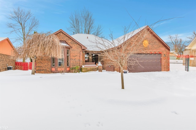 view of front of property with brick siding and fence