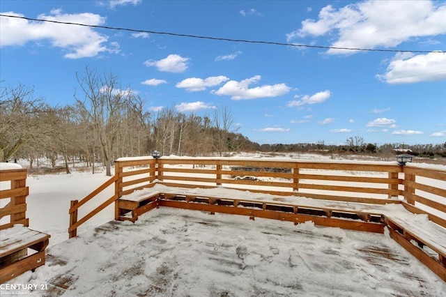 view of snow covered deck