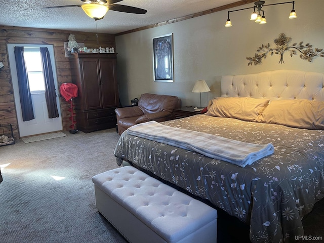 bedroom with carpet, ceiling fan, and a textured ceiling