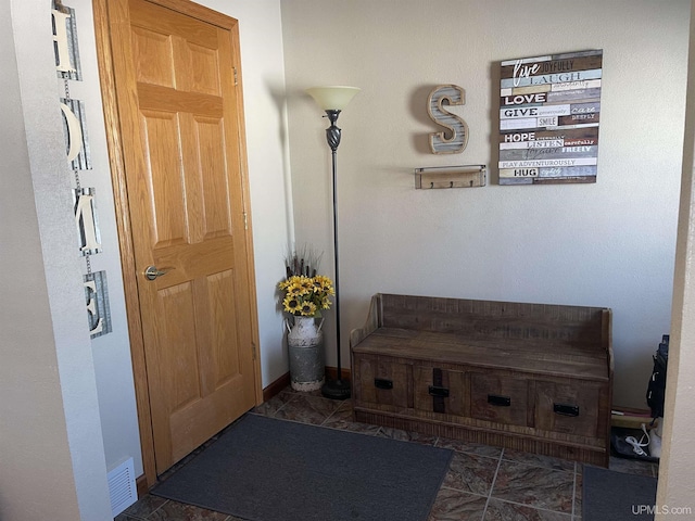 interior space with visible vents and baseboards