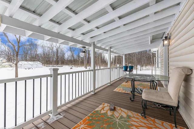 view of snow covered deck