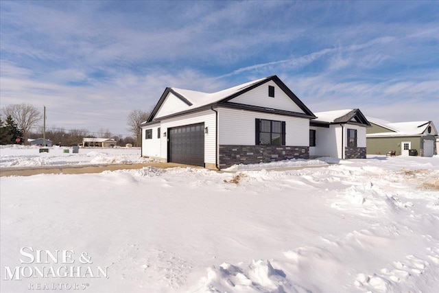 modern farmhouse with an attached garage