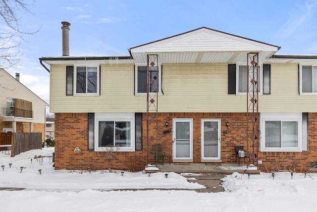 view of front of home with brick siding