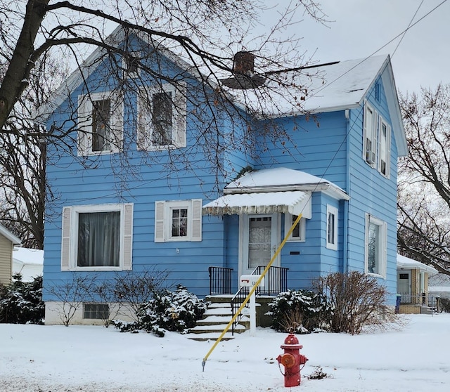 view of front of home featuring a chimney