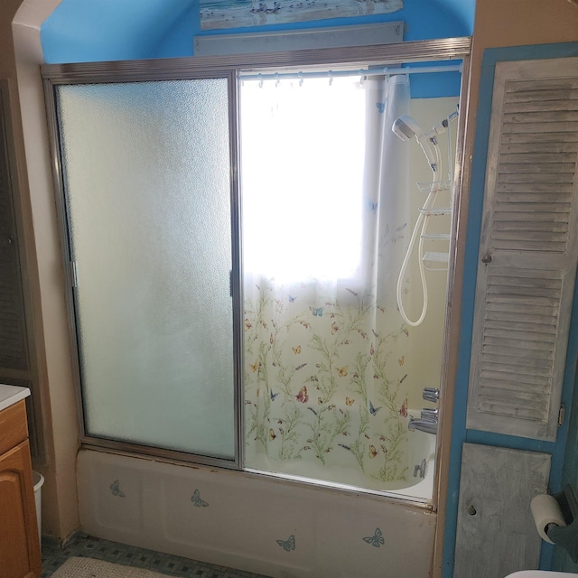 full bathroom with shower / bath combination with glass door, vanity, and toilet