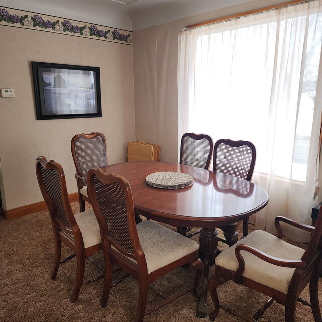 dining room with baseboards