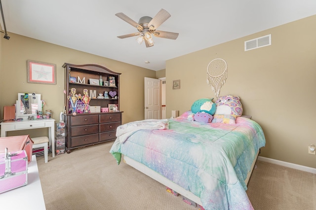 bedroom with light carpet, baseboards, visible vents, and a ceiling fan