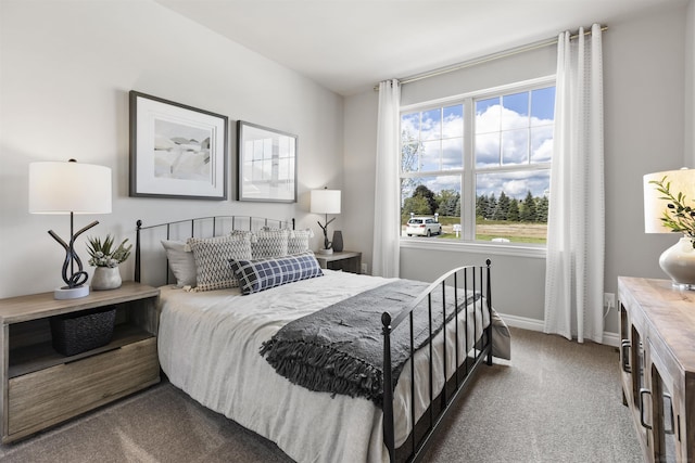 carpeted bedroom with baseboards